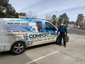 Comfort Pro Technician in-front of Comfort Pro van with face mask from Confort Ptro Heatign and Cooling Prescott AZ